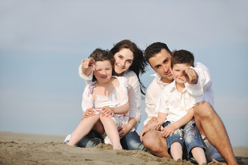 happy young family have fun on beach