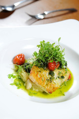 Tasty healthy fish fillet with steamed vegetables