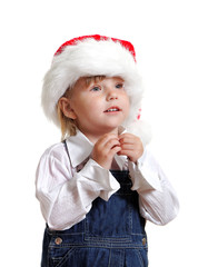 Christmas kid in Santa hat .