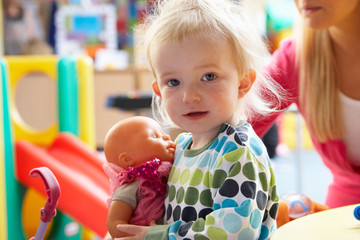 Young girl playing with toys