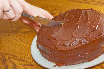 Cutting a chocolate cake
