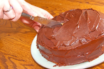 Cutting a chocolate cake