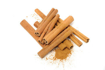 Cinnamon Sticks and Ground Cinnamon Isolated on White Background