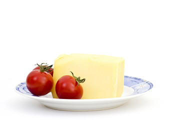 yellow cheese in plate with tomato
