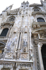 The Gothic facade of the Cathdral in Milan Italy