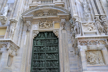 The Gothic facade of the Cathdral in Milan Italy