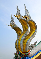 Fototapeta na wymiar Thai dragon or king of Naga statue with three heads.