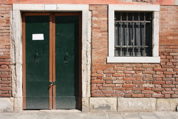 Fototapeta na wymiar Door and window in Venice, Italy