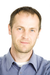 Fototapeta premium young man wearing blue shirt posing on white background