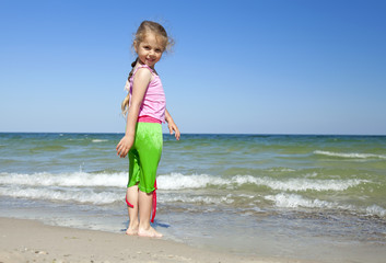 Happy child at the summer beach.