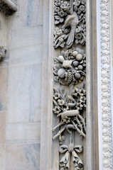 Detail in the Gothic facade of the Cathedral in Milan Italy