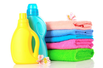 Detergent and towels isolated on white