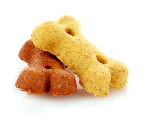 Dry food for dogs in bones shapes isolated on white