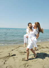 Fototapeta na wymiar happy young couple have fun on beach