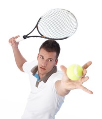 Handsome tennis player serving