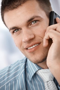 Closeup portrait of businessman on phone