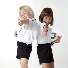 Two girls as football fans showing thumbs up for Woman´s WC