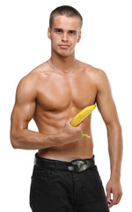 Muscle sexy wet naked young man hold the banana in hand