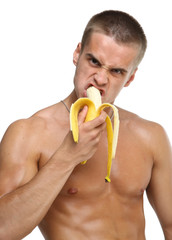Muscle sexy wet naked young man eating the banana