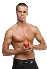 Muscle sexy wet naked young man hold the red apple in hands