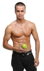 Muscle sexy wet naked young man hold the green apple in hands