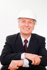 old builder in the helmet