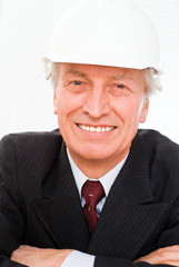old builder in the helmet