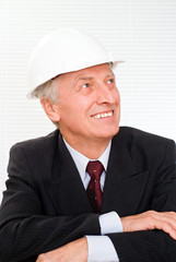 old builder in the helmet