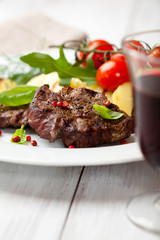 Grilled beef with grilled vegetables and fresh basil
