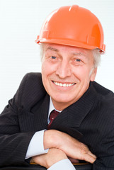 old builder in the helmet