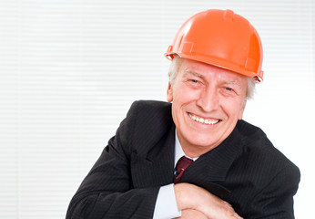 old builder in the helmet