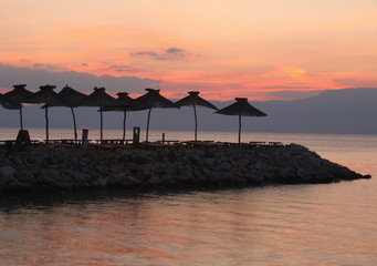 Beach umbrellas and sunset