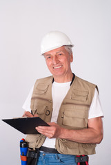 senior builder writing