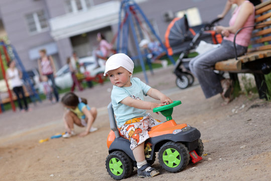 Child drives toy ATV