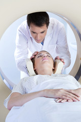 Obraz na płótnie Canvas Woman going through MRI scan