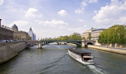 Naklejka premium Passenger ship boat sails on the river Seine. Paris