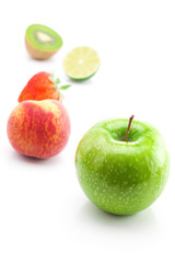 big juicy red ripe strawberries,apple,lime,peach and kiwi  isola
