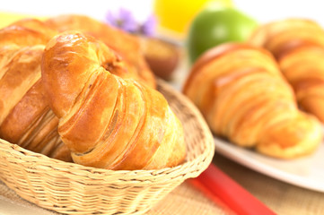 Fresh croissants in bread basket