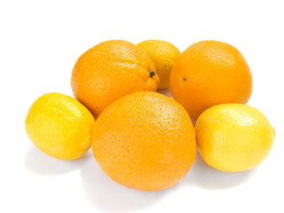 Fresh oranges and lemons isolated over white