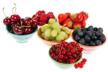 Colorful bowls fresh summer fruit
