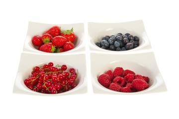 Fresh fruit in modern white bowls