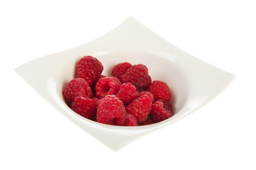 White bowl with raspberries