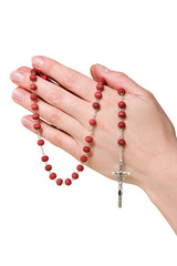 female hands with rosary. isolated on white.