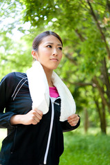 beautiful asian woman jogging in the park