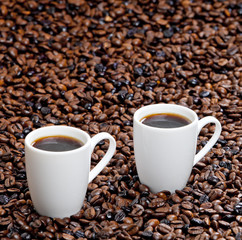 still life of coffee cups and coffee beans