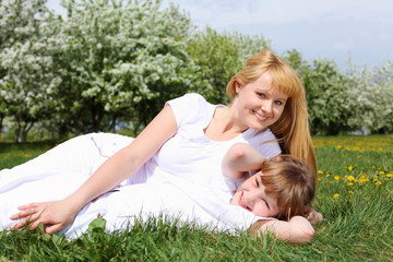 Fototapeta premium girl with mother in spring park