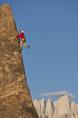 Rock climber rappelling.