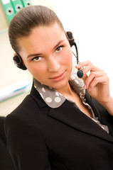 Young business woman wearing headphones
