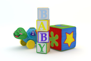 Wood toy blocks spelling baby with baby toys in background