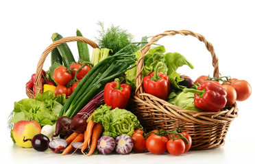 Composition with raw vegetables and wicker basket